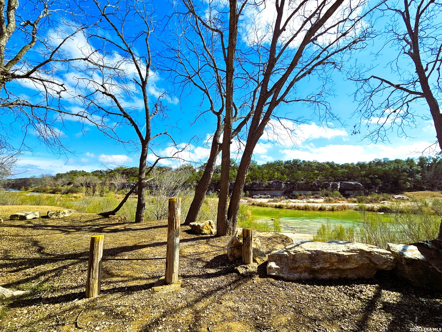 605 Lakeshore Lane Bandera, TX 78003 - Photo 28 of 32 a view of a lake with a yard