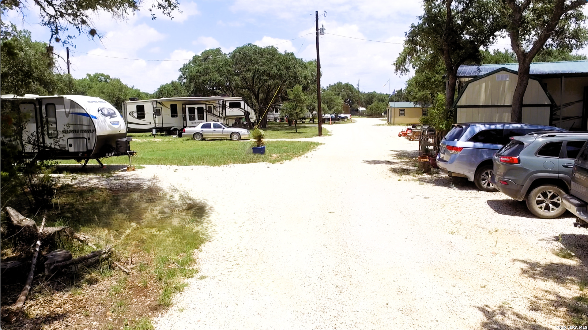 605 Lakeshore Lane Bandera, TX 78003 - Photo 32 of 32 a view of street with parked cars