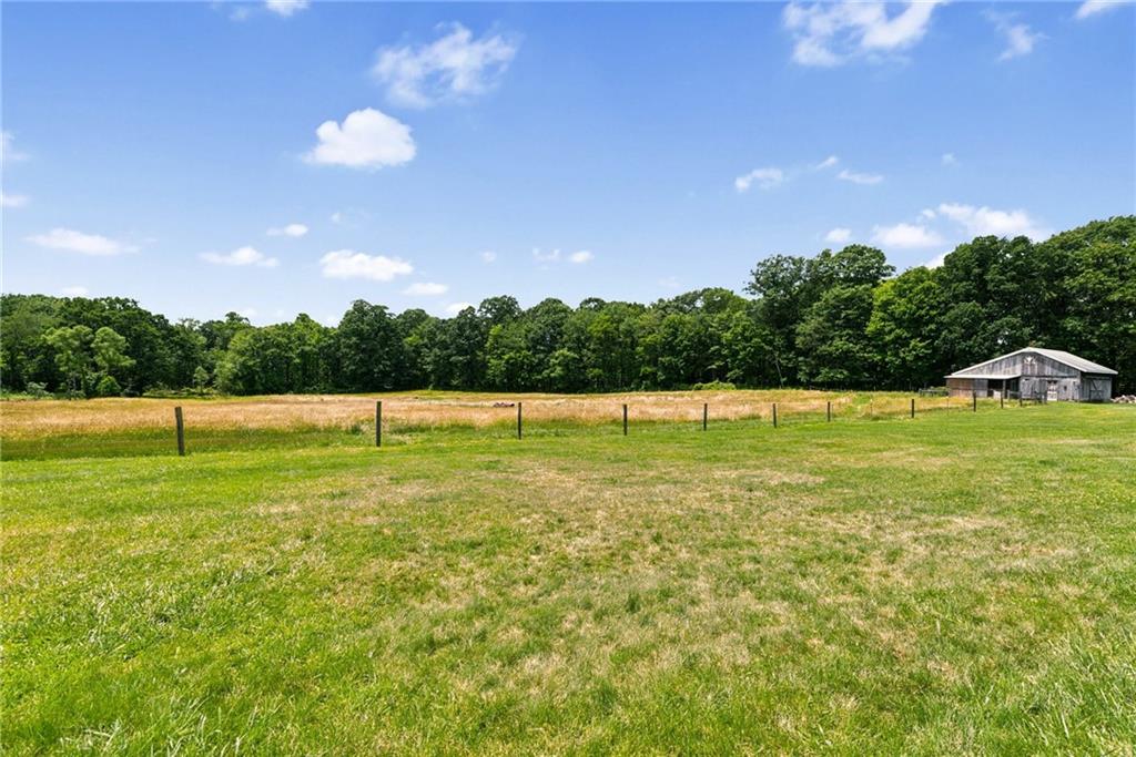 114 Gardner Road Dawson, PA 15428 - Photo 45 of 49 a view of a green field with trees in the background