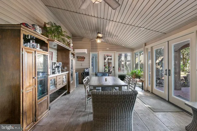 a living room with furniture potted plant and a lamp
