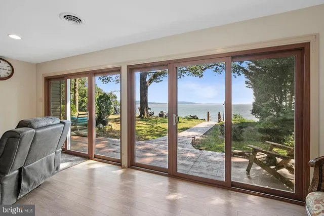 a bedroom with a bed and a mirror