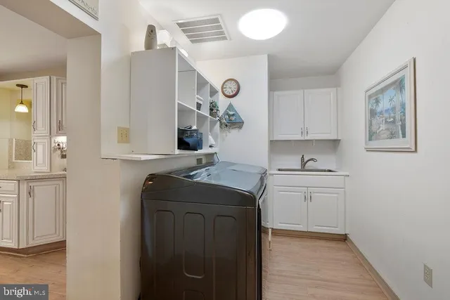 a view of a livingroom with hardwood floor and a ceiling fan