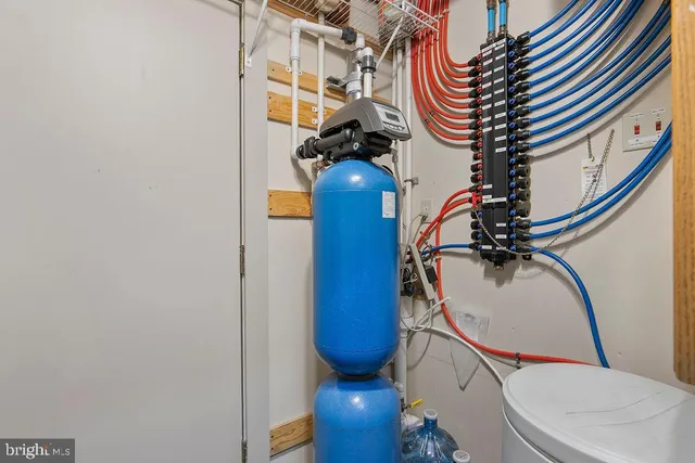 a view of a room with gym equipment and a window