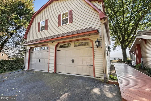 a view of a wooden fence and trees