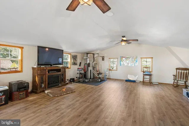 a view of a house with a yard and tree s