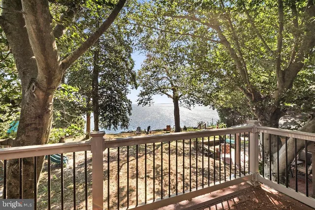 a view of a street with a house in the background