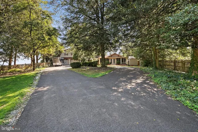 a front view of house with yard outdoor seating and green space