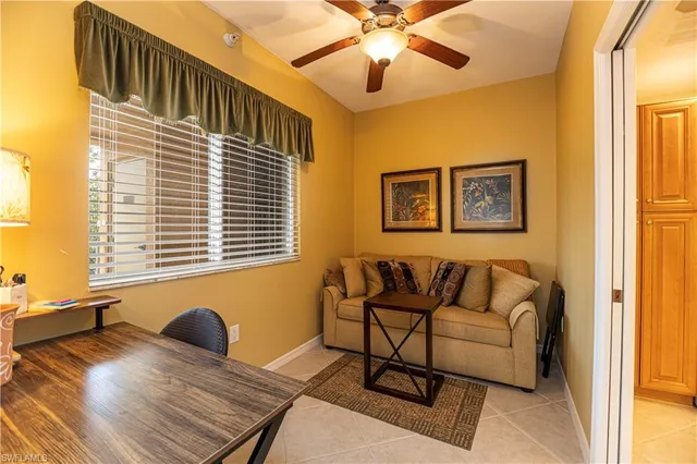 a bedroom with furniture and a window