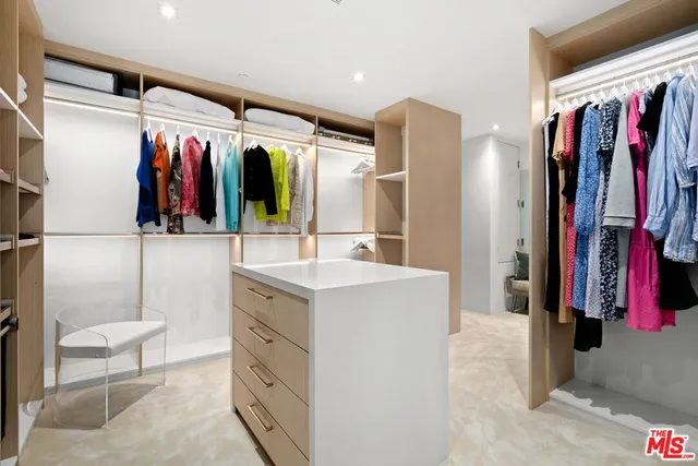 a bathroom with a sink vanity and mirror