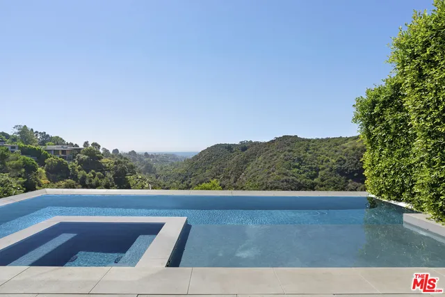 a view of a yard with an outdoor seating