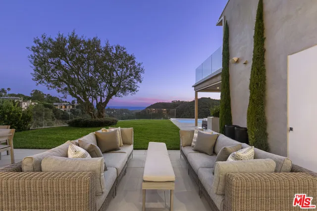 a view of house with outdoor space and seating