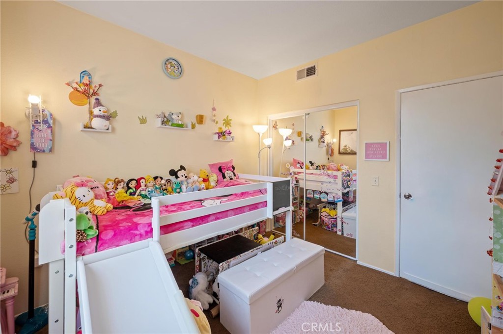 20000 Plum Canyon Road, Unit 316 Saugus, CA 91350 - Photo 14 of 27 a living room with a couch and a table