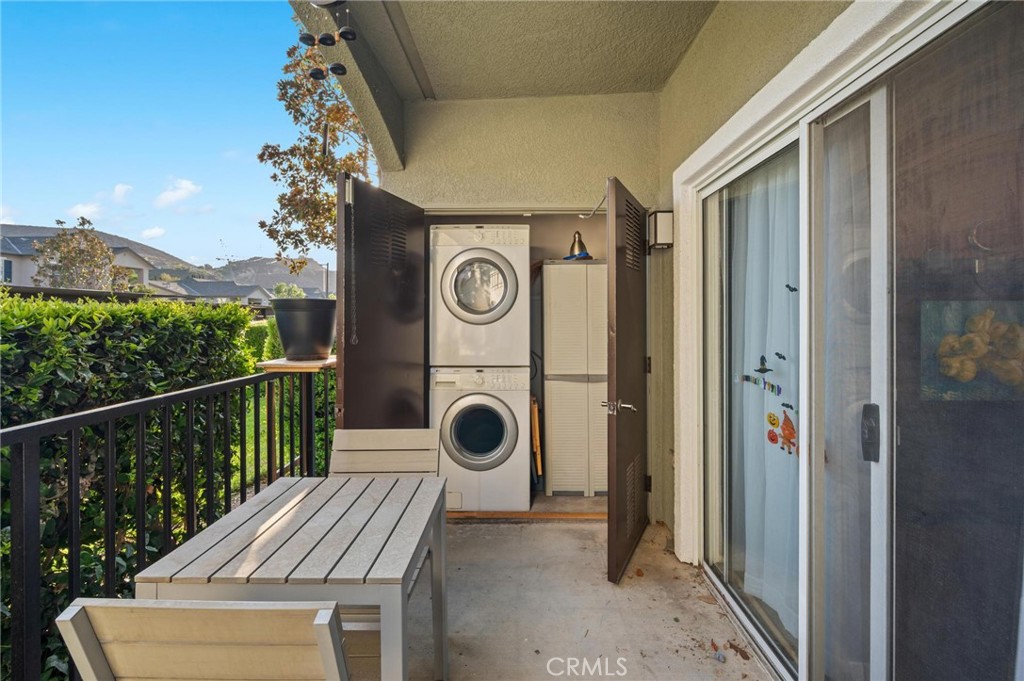 20000 Plum Canyon Road, Unit 316 Saugus, CA 91350 - Photo 17 of 27 a view of a door and chair in the balcony