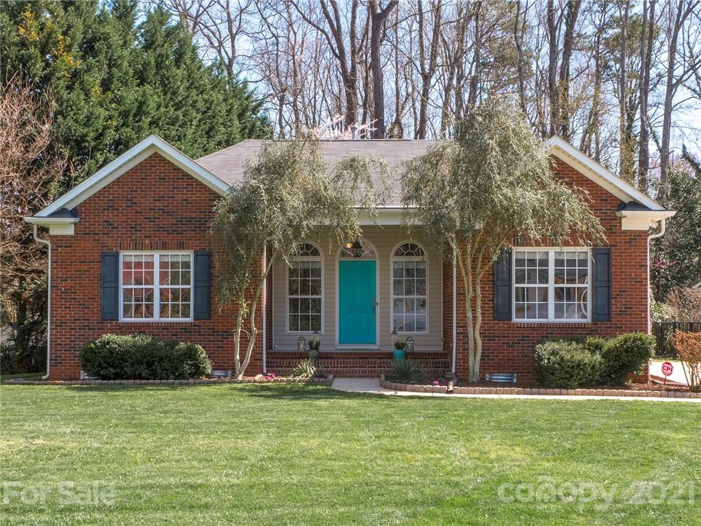 front view of a house with a garden