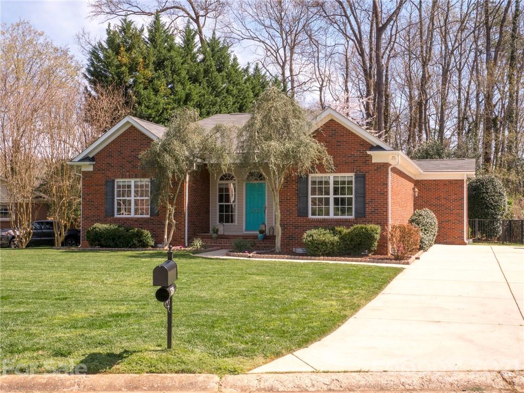 5725 Brookhaven Road Charlotte, NC 28210 - Photo 2 of 39 a front view of a house with a yard
