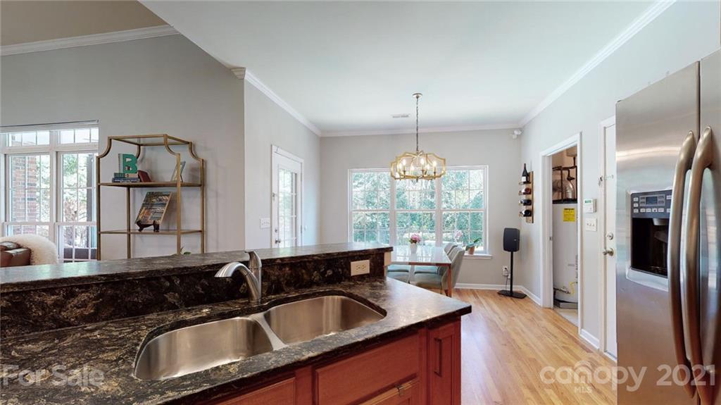 5725 Brookhaven Road Charlotte, NC 28210 - Photo 20 of 39 a kitchen with granite countertop a sink and refrigerator