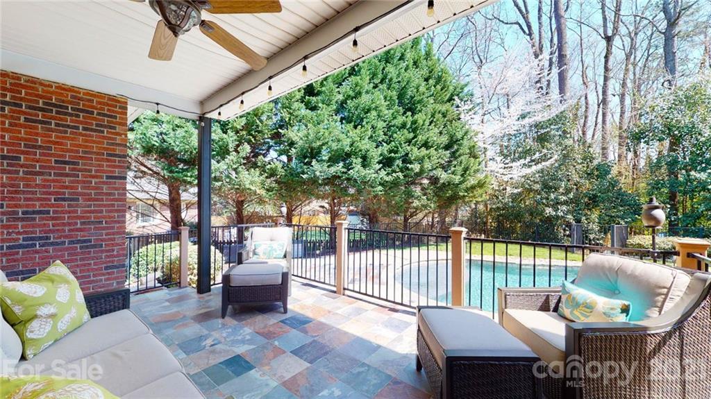 5725 Brookhaven Road Charlotte, NC 28210 - Photo 24 of 39 a view of a patio with a table and chairs