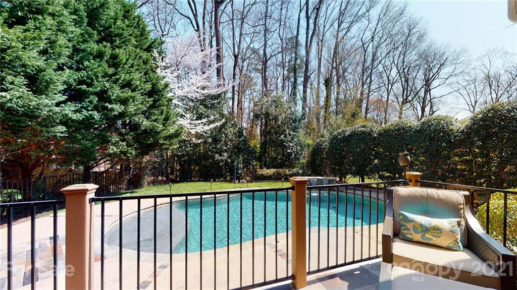 5725 Brookhaven Road Charlotte, NC 28210 - Photo 25 of 39 a view of a balcony with wooden floor and fence