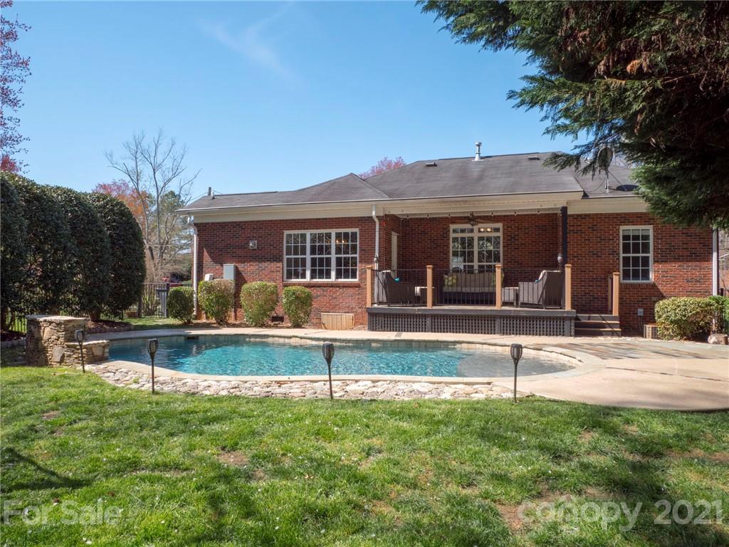 5725 Brookhaven Road Charlotte, NC 28210 - Photo 30 of 39 a view of a house with swimming pool and a yard