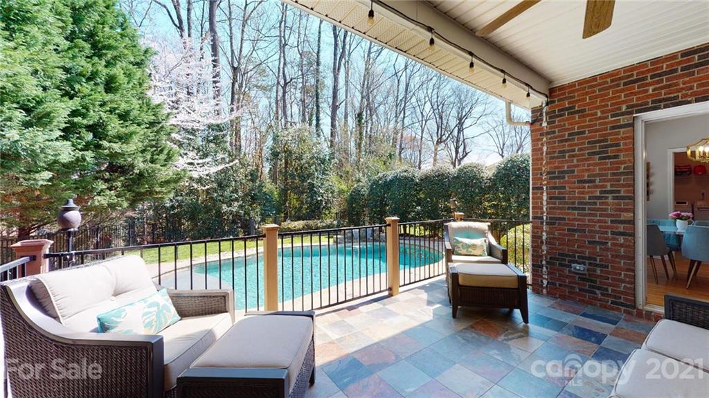 5725 Brookhaven Road Charlotte, NC 28210 - Photo 31 of 39 a balcony with couch and chairs