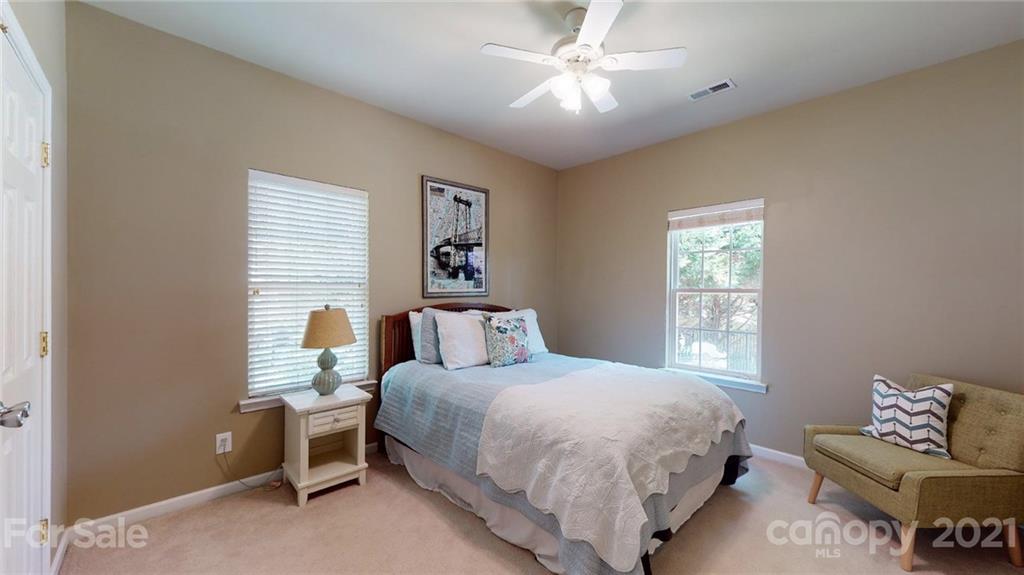 5725 Brookhaven Road Charlotte, NC 28210 - Photo 35 of 39 a bedroom with a bed couch and window