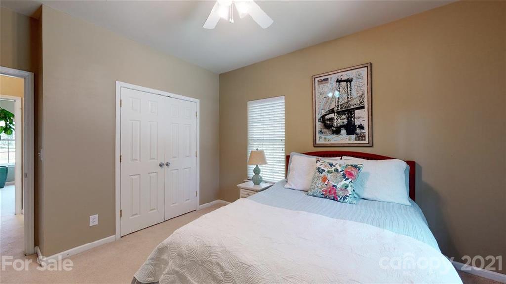 5725 Brookhaven Road Charlotte, NC 28210 - Photo 36 of 39 a bedroom with a bed and a window
