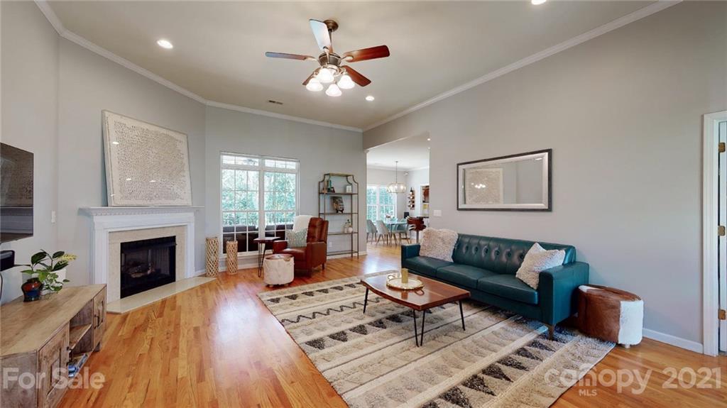 5725 Brookhaven Road Charlotte, NC 28210 - Photo 6 of 39 a living room with furniture and a fireplace