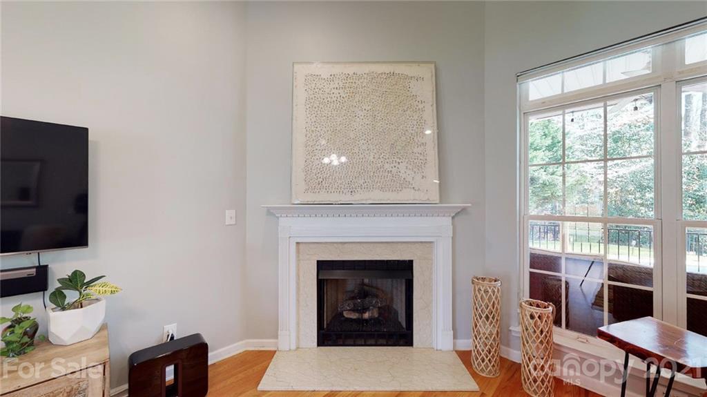 5725 Brookhaven Road Charlotte, NC 28210 - Photo 7 of 39 a living room with furniture and a fireplace