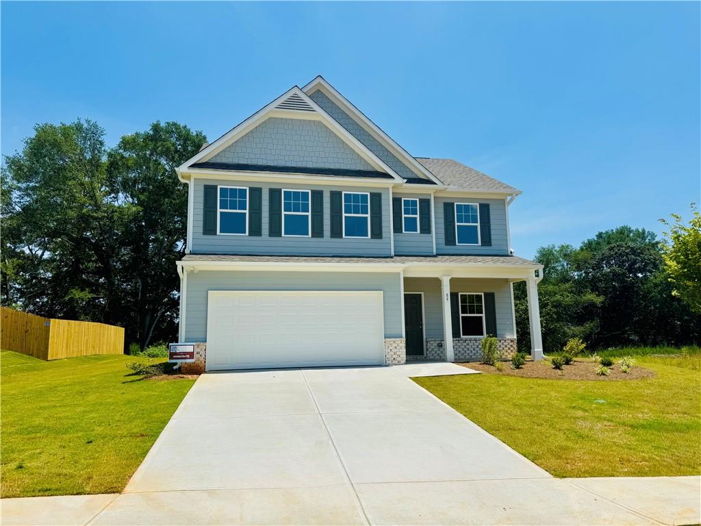 89 Hampton Ridge Way Jefferson, GA 30549 - Photo 1 of 1 a front view of a house with a yard