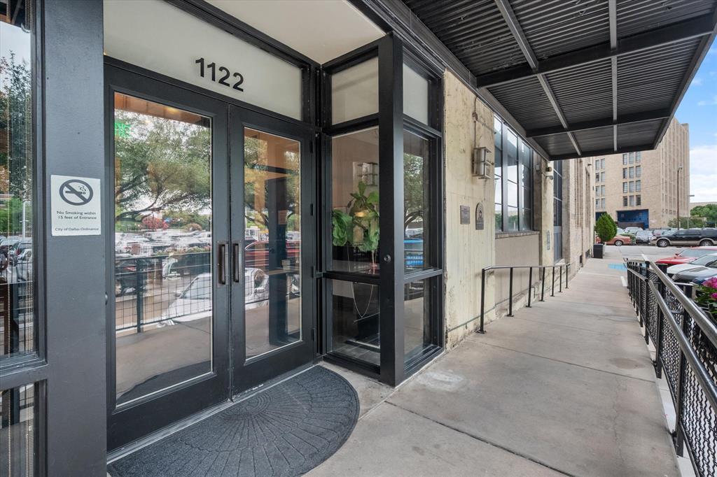 1122 Jackson Street, Unit 418 Dallas, TX 75202 - Photo 23 of 23 a view of a hallway with the view of the house