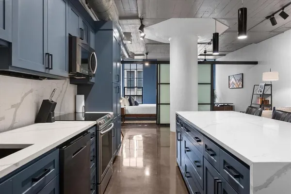 a kitchen that has a lot of cabinets in it