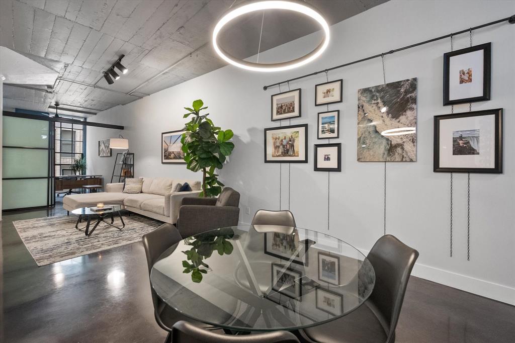 1122 Jackson Street, Unit 418 Dallas, TX 75202 - Photo 5 of 23 a living room with furniture and wooden floor