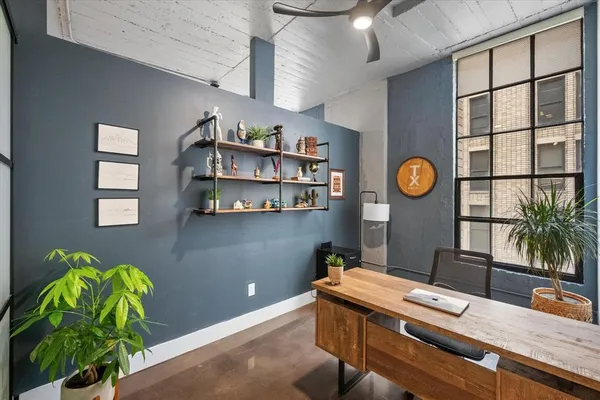 a room with cabinets and wooden floor