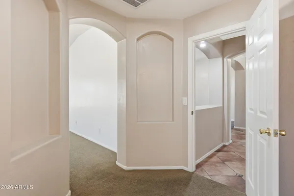 a view of a kitchen with an empty space and a ceiling fan
