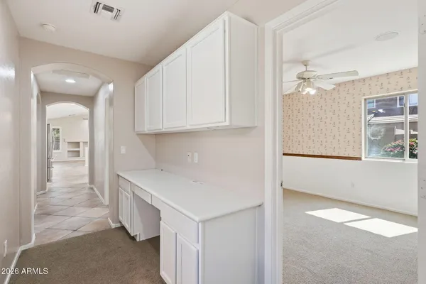 a spacious bathroom with a double vanity sink a mirror and a bathtub