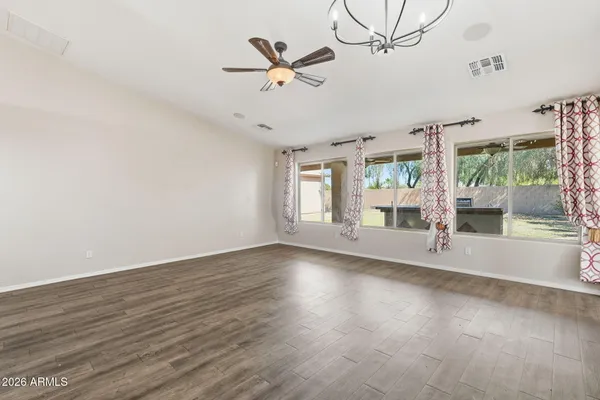 a view of room with window and wooden floor