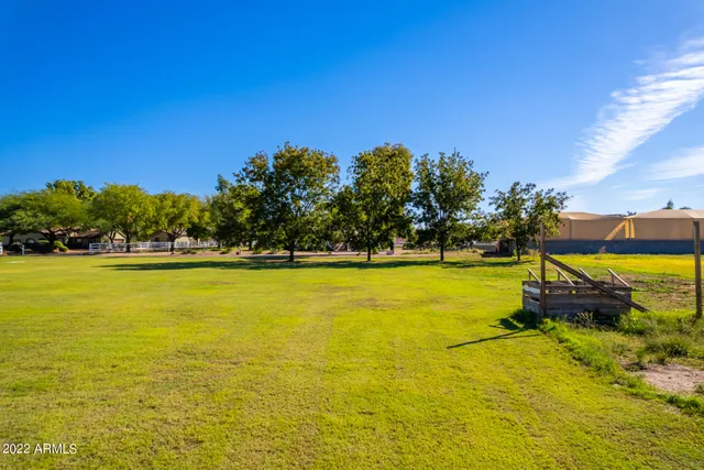 a view of a swimming pool with an outdoor space and seating area