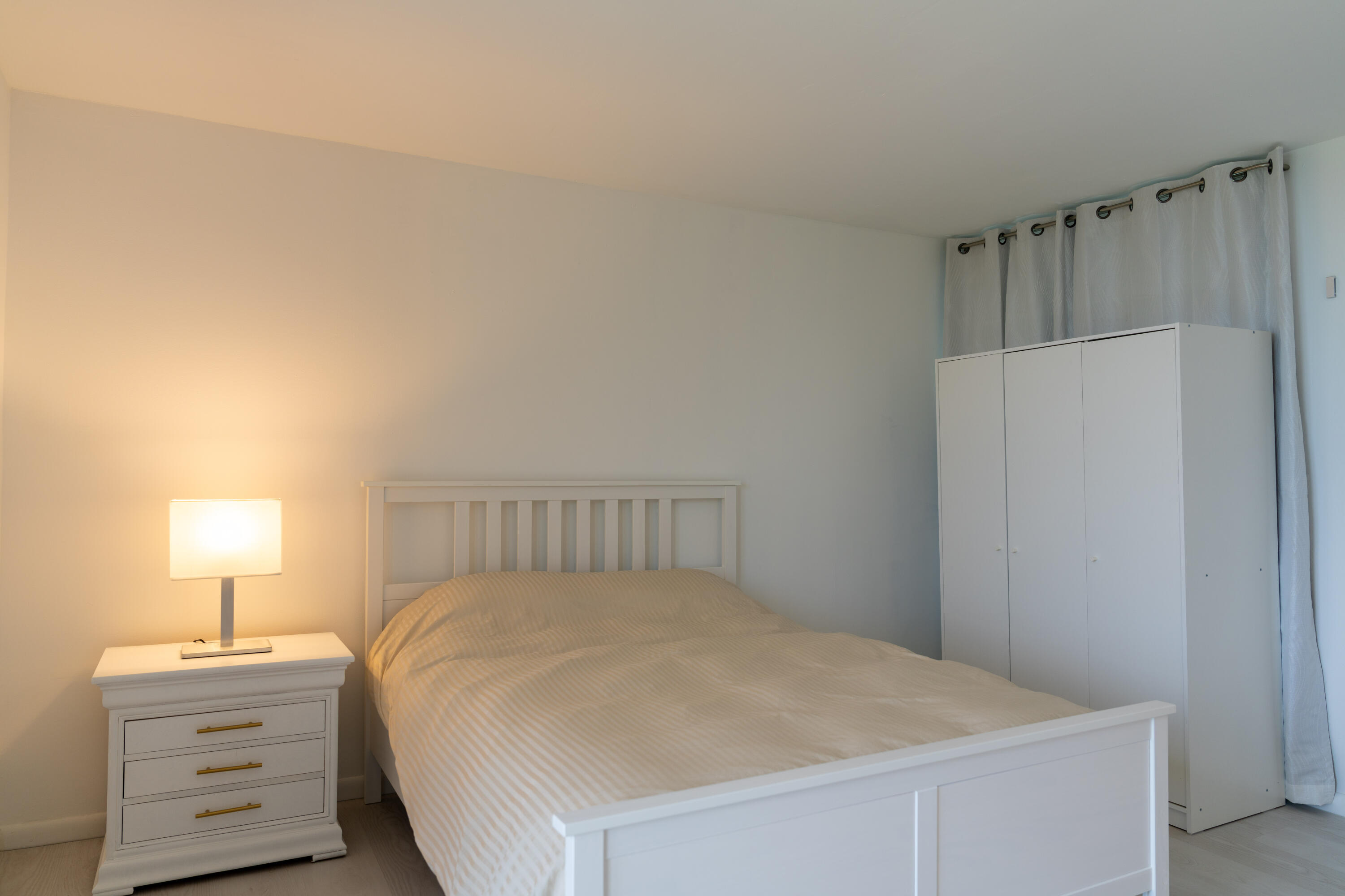 400 Ocean Trail Way, Unit 101 Jupiter, FL 33477 - Photo 5 of 21 a bedroom with a bed and a closet