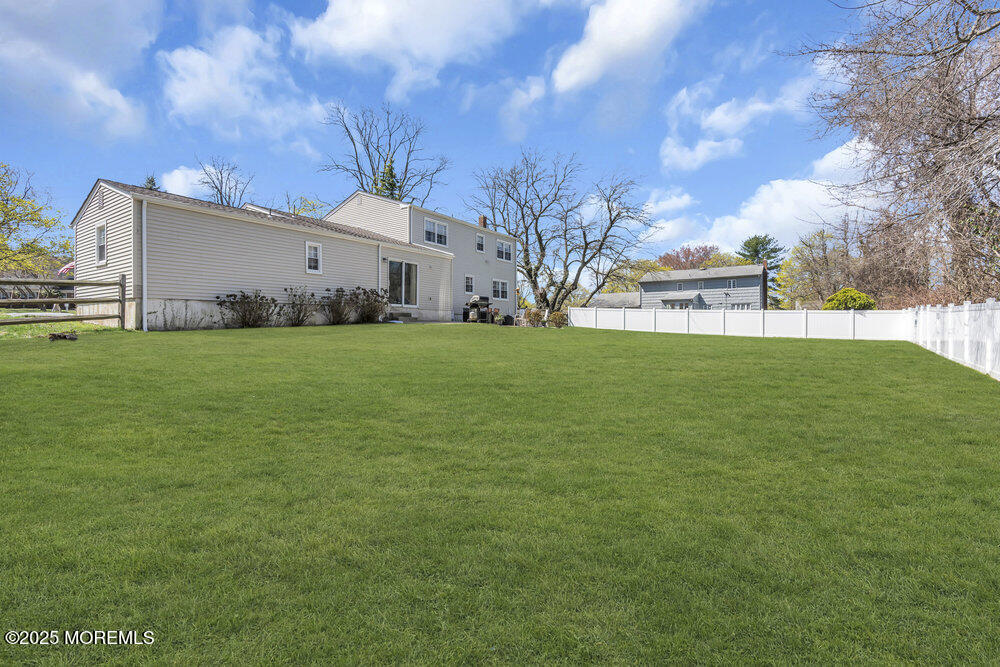 4 Koosman Drive Middletown, NJ 07737 - Photo 25 of 27 a view of a backyard with large trees