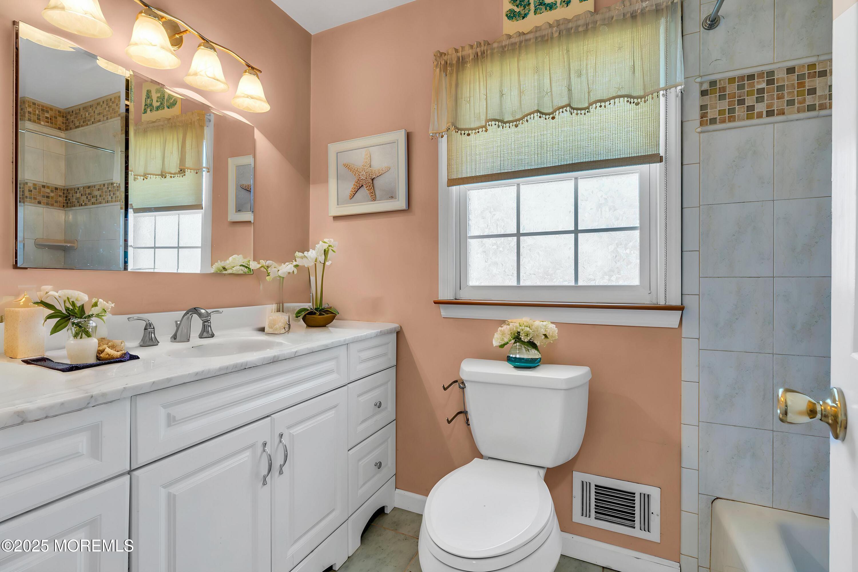 4 Koosman Drive Middletown, NJ 07737 - Photo 10 of 27 a bathroom with a granite countertop toilet sink and mirror