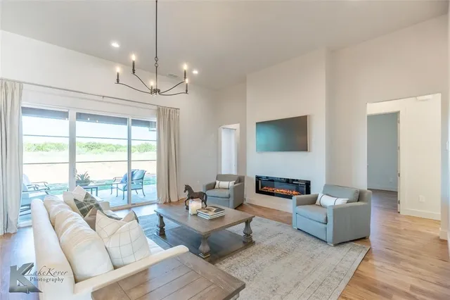 a living room with furniture or outdoor view and a large window