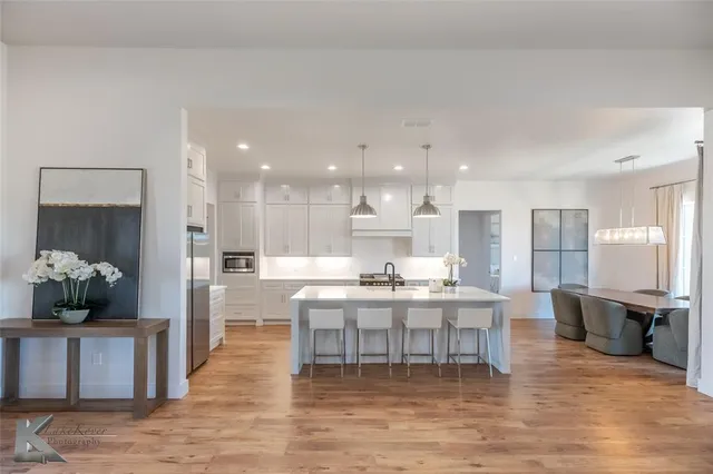 a kitchen with a table and chairs