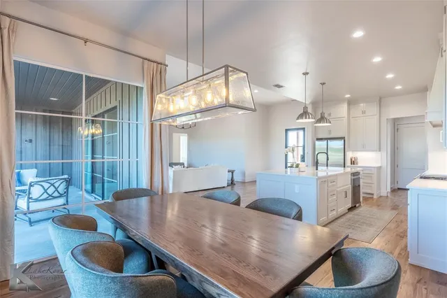 a kitchen with a table and chairs