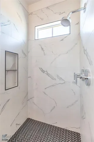 a bathroom with a sink and a shower