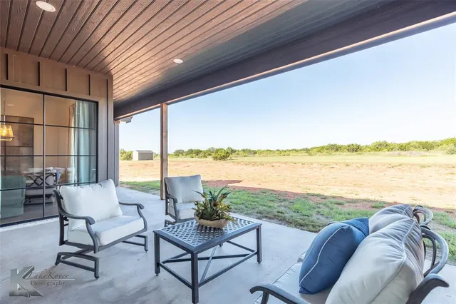 a living room with couches and ocean view