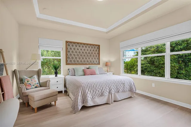 a bedroom with a bed and a couch