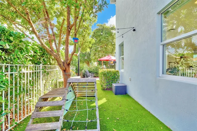 a backyard of a house with seating space