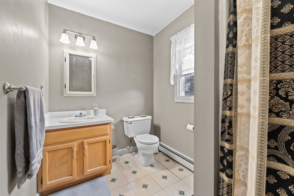 23 Orono Street Worcester, MA 01606 - Photo 17 of 29 a bathroom with a sink a toilet and shower