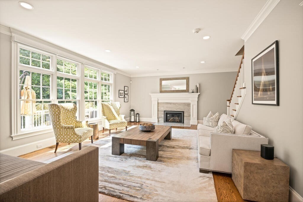23 Richard Road Lexington, MA 02421 - Photo 12 of 42 a living room with furniture large window and a fireplace