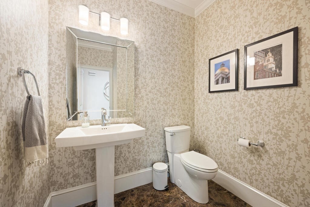 23 Richard Road Lexington, MA 02421 - Photo 14 of 42 a bathroom with a toilet a sink and mirror